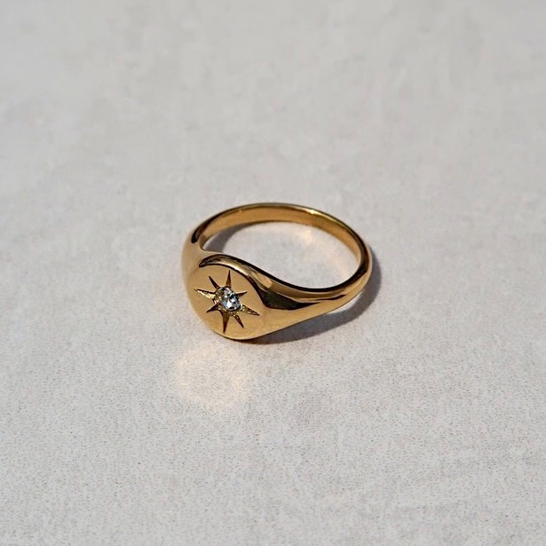 North star signet ring photographed for a marketplace product listing